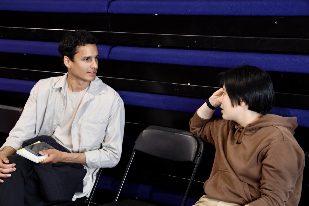 Two people talking at an event